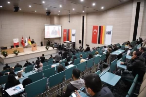Almanya'daki Türk Varlığının 60 Yılı Sempozyumu programında konuşan YTB Başkanı